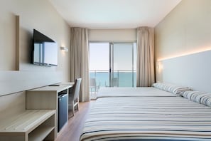 A modern hotel room with a large bed, a desk, a flat-screen TV, and a balcony with a view of the sea. - Hotel Best Sabinal (Roquetas de Mar)