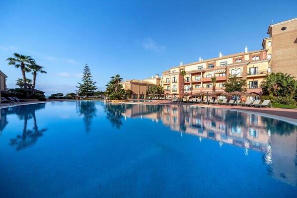 Outdoor pool, pool umbrellas, sun loungers