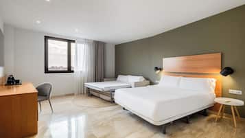 A modern hotel room with a bed, a desk, a chair, and a large window.