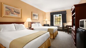 A hotel room with two beds, a desk, a chair, a television, and a window with curtains. - Days Inn by Wyndham Altavista (Altavista)