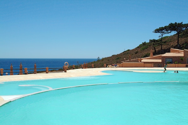 2 outdoor pools, open 10:00 AM to 9:00 PM, pool loungers