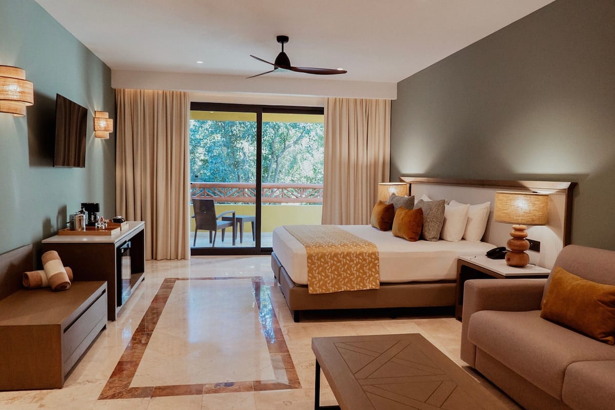 Junior Suite | Free minibar items, in-room safe, blackout drapes, iron/ironing board