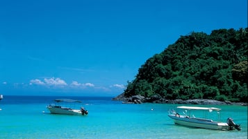 On the beach, sun loungers, beach umbrellas, beach towels