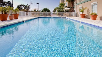 Outdoor pool, open 9 AM to 10 AM, sun loungers