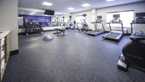 A gym with treadmills, elliptical machines, and free weights. - Holiday Inn Express Hotel & Suites Atlanta Johns Creek by IHG (Suwanee)