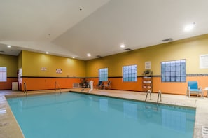 Indoor pool, open 7 AM to 11 PM, pool loungers