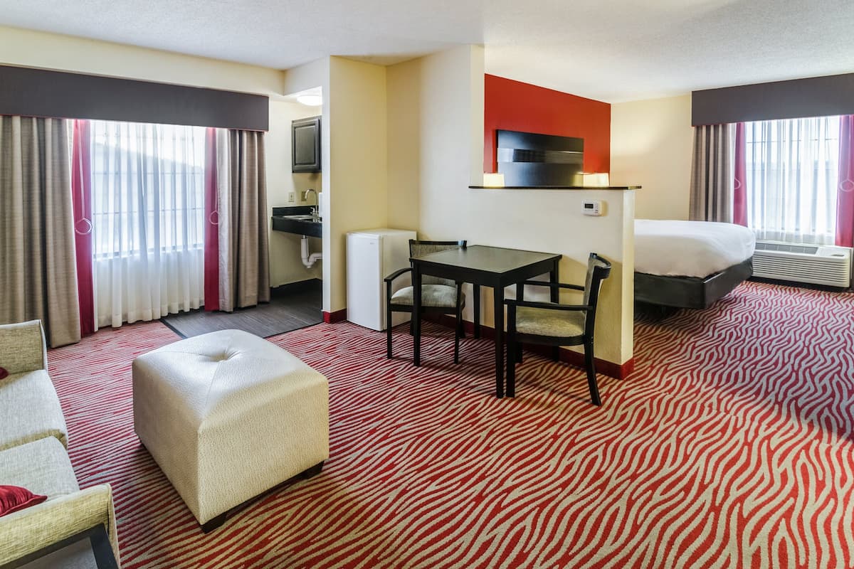 Suite, 1 King Bed, Accessible (Mobility, Accessible Tub) | In-room safe, desk, iron/ironing board, free cribs/infant beds