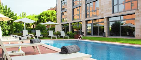 Seasonal outdoor pool, pool umbrellas, pool loungers