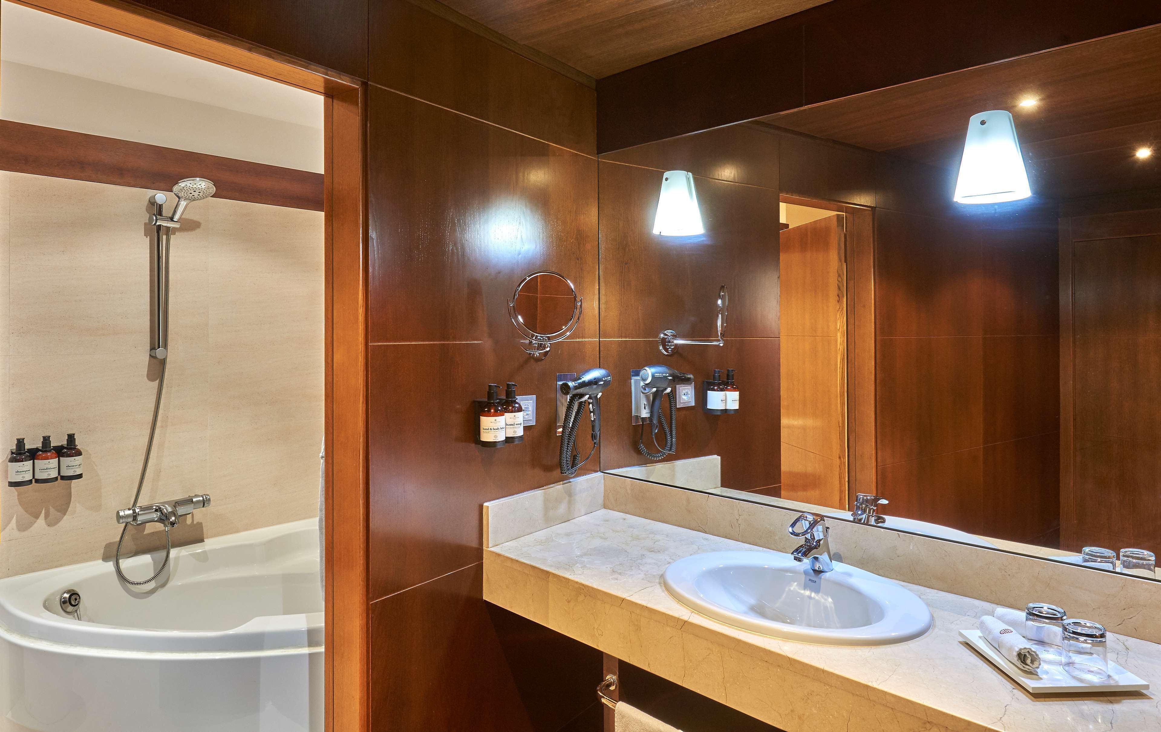 eco-friendly toiletries, hair dryer, towels