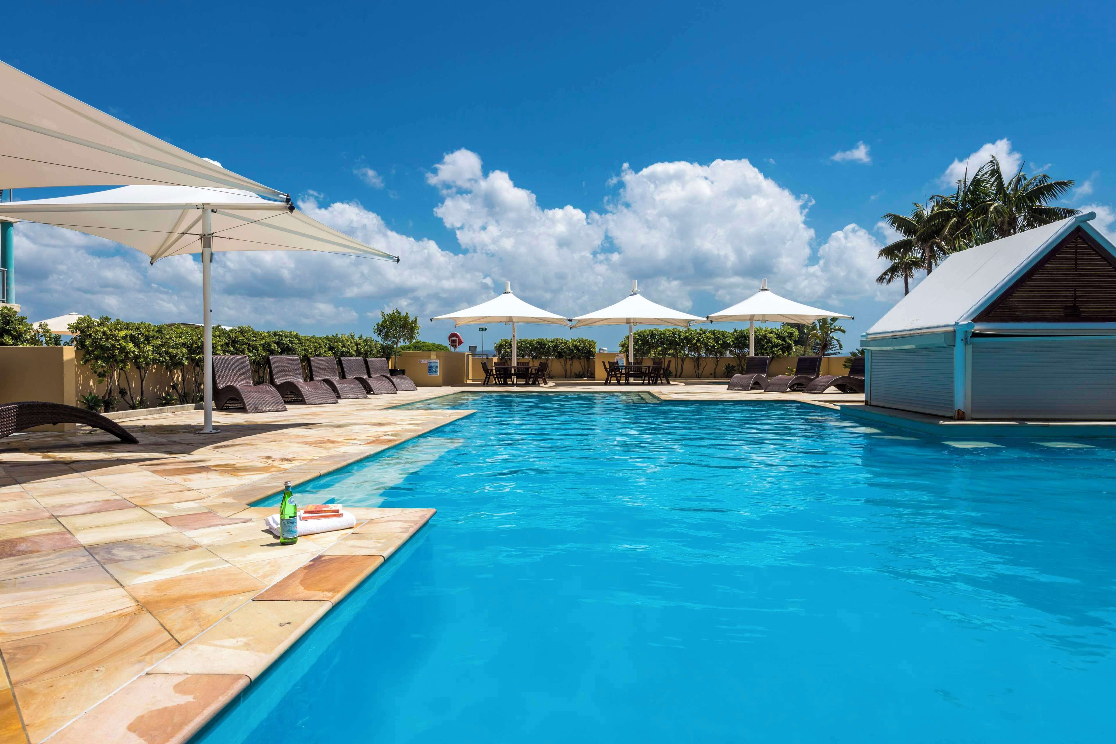 Outdoor pool, pool umbrellas, pool loungers