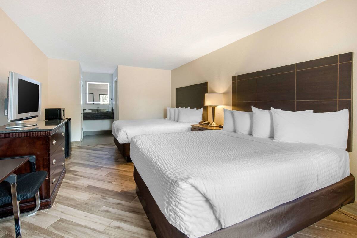 Standard Room, 2 Queen Beds, Non Smoking | In-room safe, desk, laptop workspace, iron/ironing board