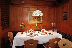 Enjoy meals with family and friends at this cabin's spacious dining table, set for four with elegant table settings and beautiful centerpieces.