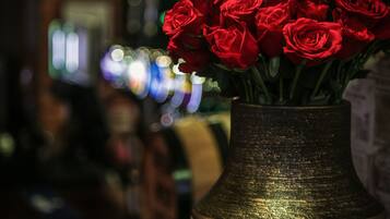 A bouquet of red roses in a vase.