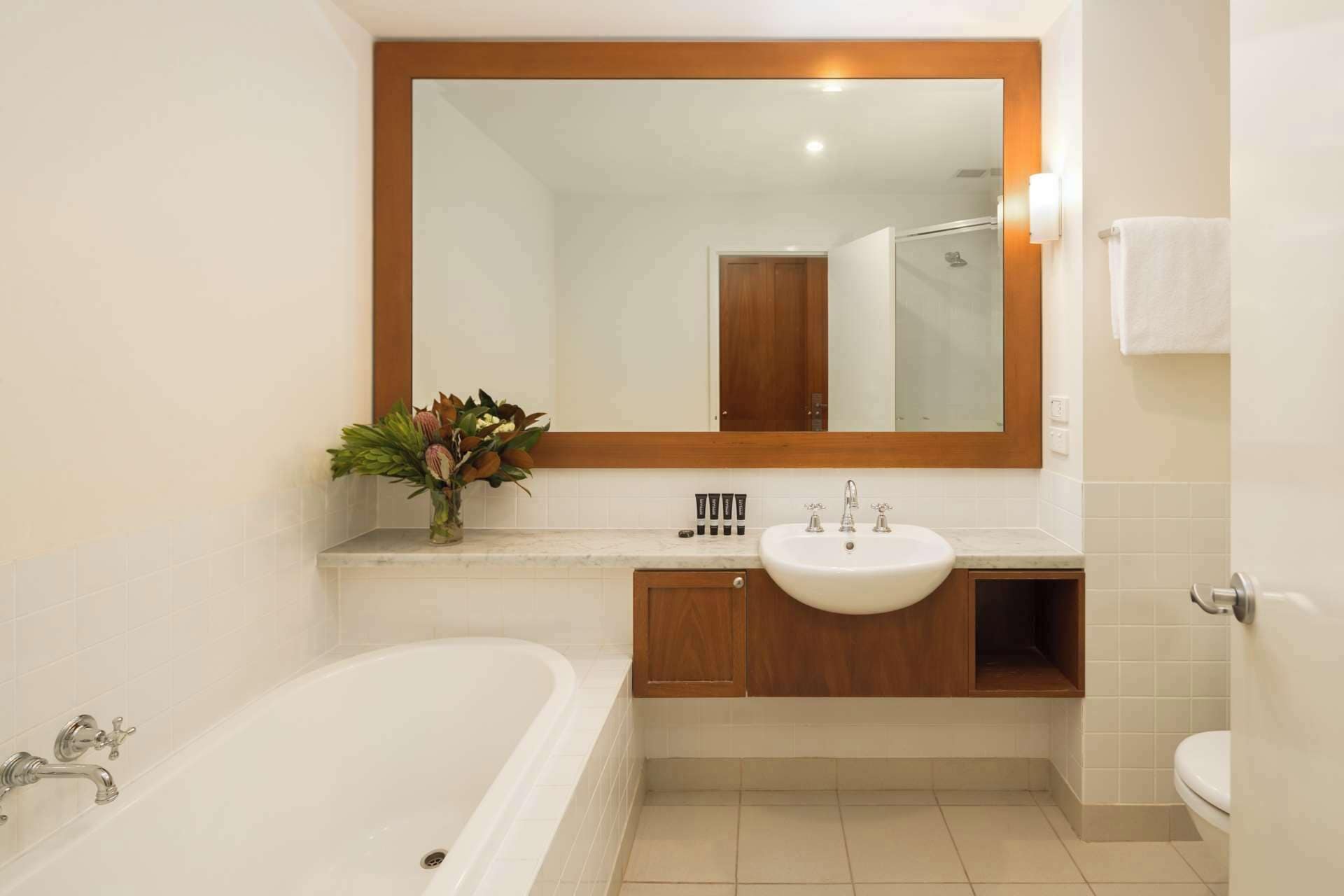 designer toiletries, hair dryer, towels, soap