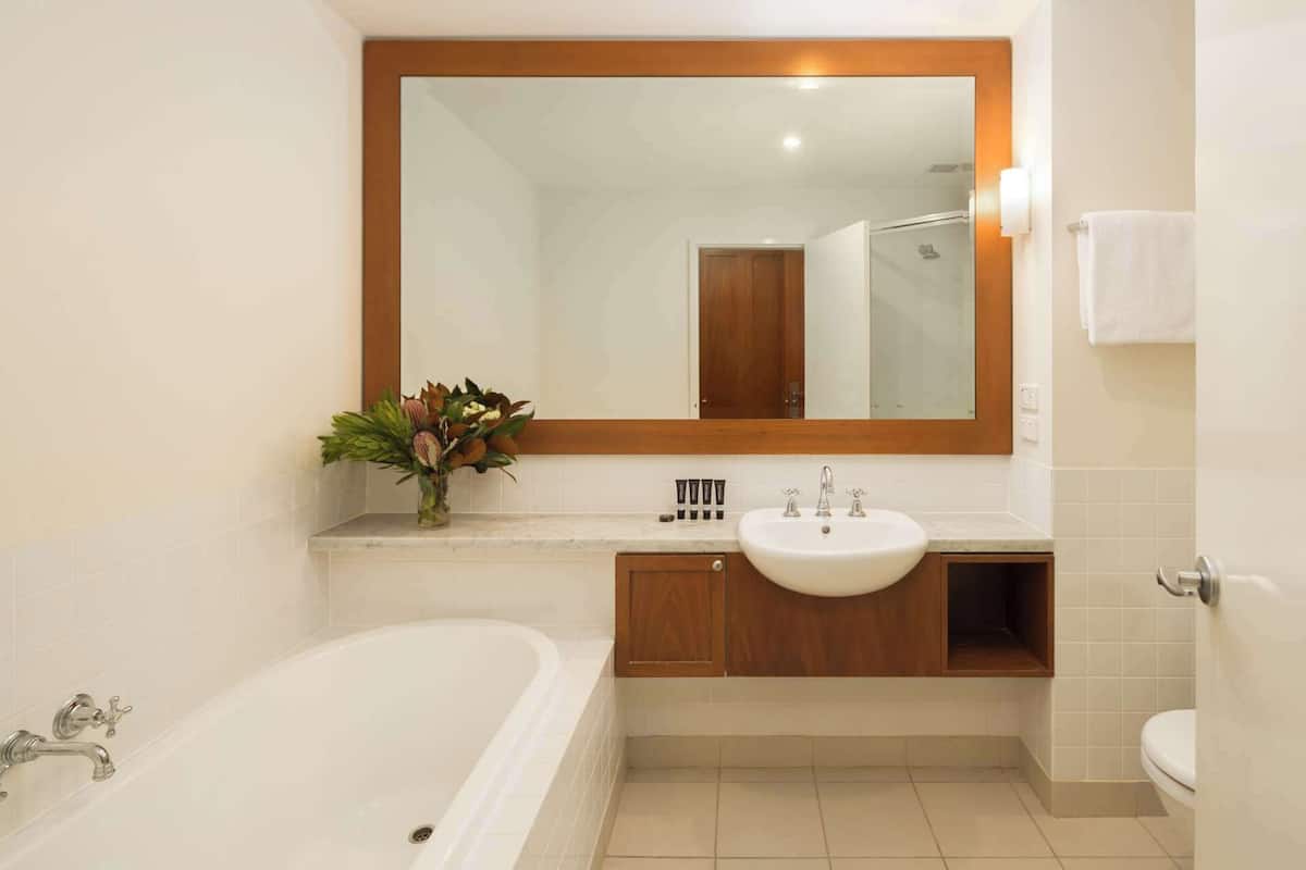 designer toiletries, hair dryer, towels, soap