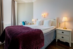 Pillow-top beds, desk, blackout curtains, free cots/infant beds