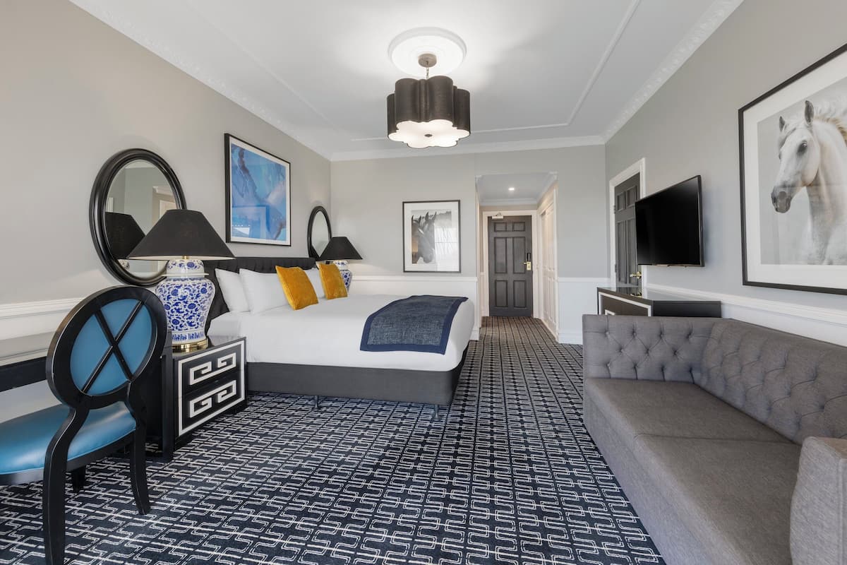 Premium bedding, desk, laptop workspace, blackout curtains