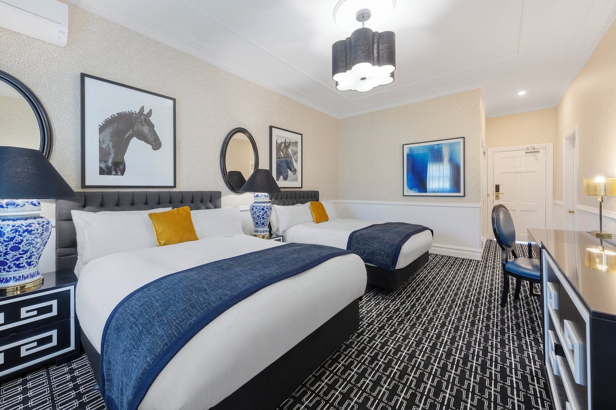 Premium bedding, desk, laptop workspace, blackout curtains