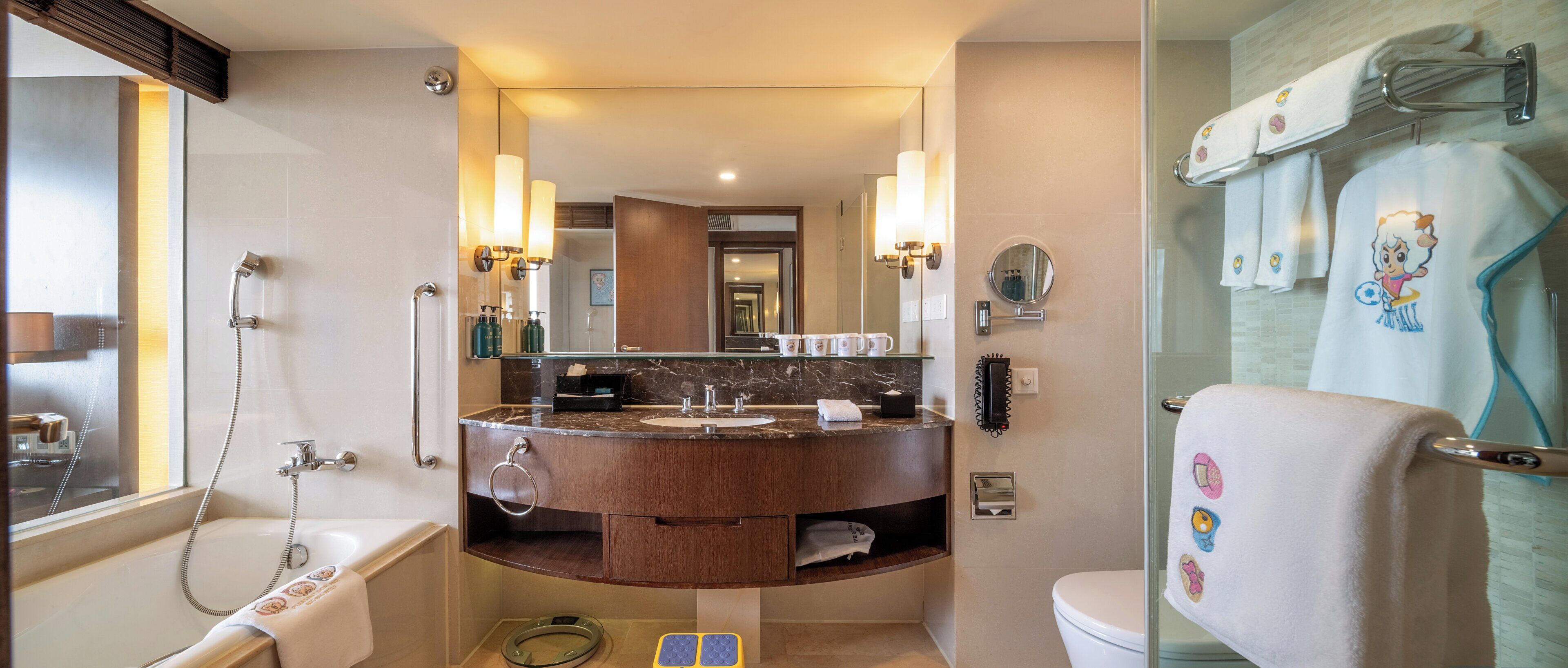 A modern bathroom with a bathtub, a vanity with a mirror, and a shower area.