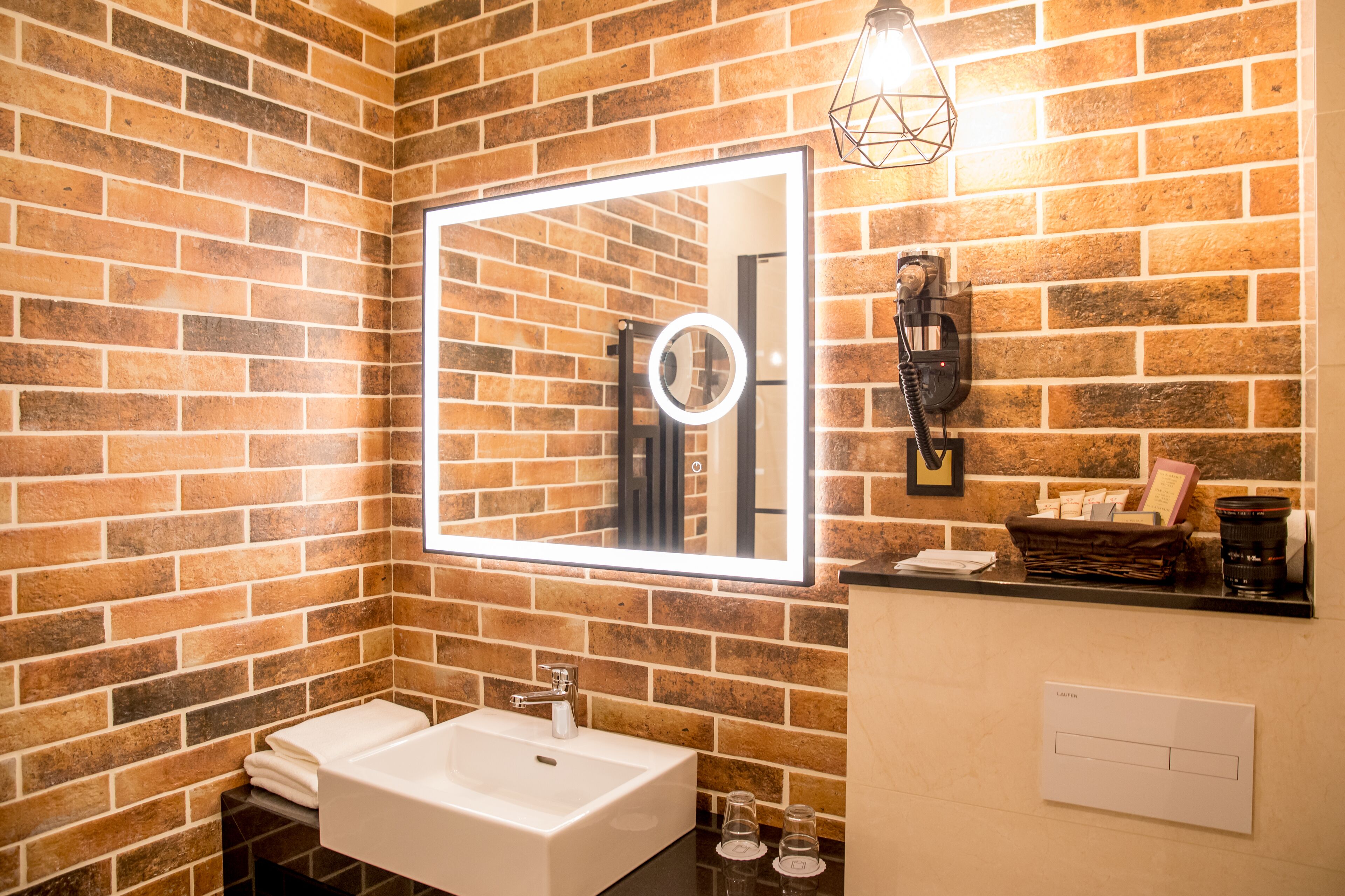 designer toiletries, hair dryer, towels, soap