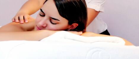 A person receiving a back massage.