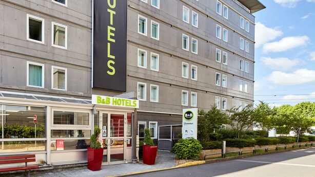 A B&B hotel with a modern facade, multiple windows, and a prominent entrance. - B&B HOTEL Paris Nord 2 CDG Aéroport (Roissy-en-France)