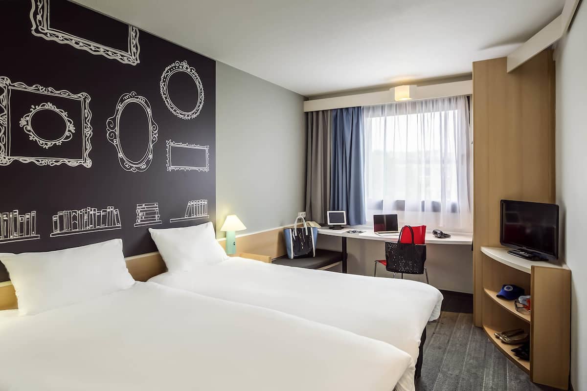 Premium bedding, memory foam beds, in-room safe, desk