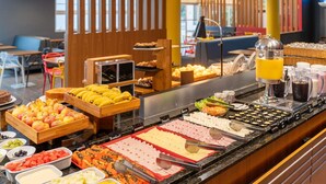 A buffet with various food items including fruits, cheeses, and meats. - ibis Paulinia (Paulinia)