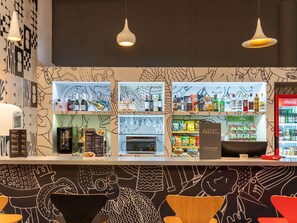 A bar area with shelves of beverages, a menu board, and a Coca-Cola refrigerator. - ibis Paulinia (Paulinia)