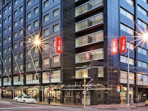 A modern hotel building with multiple floors, large windows, and a prominent 'Ibis Hotel' sign. - ibis Wellington (Wellington)