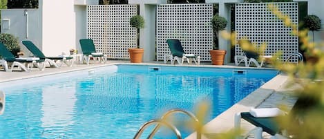 Seasonal outdoor pool, pool loungers