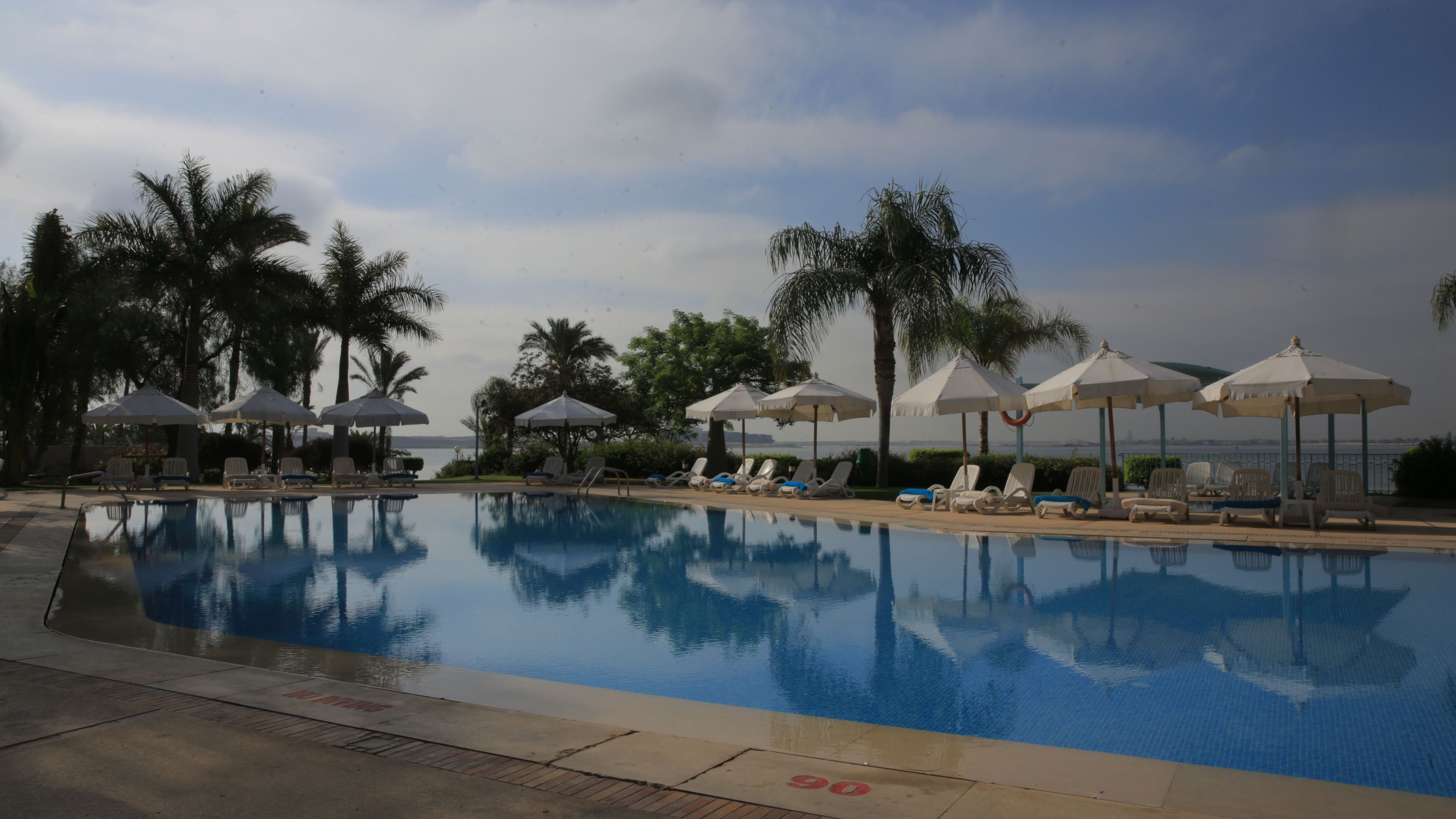 outdoor pool, pool umbrellas, pool loungers