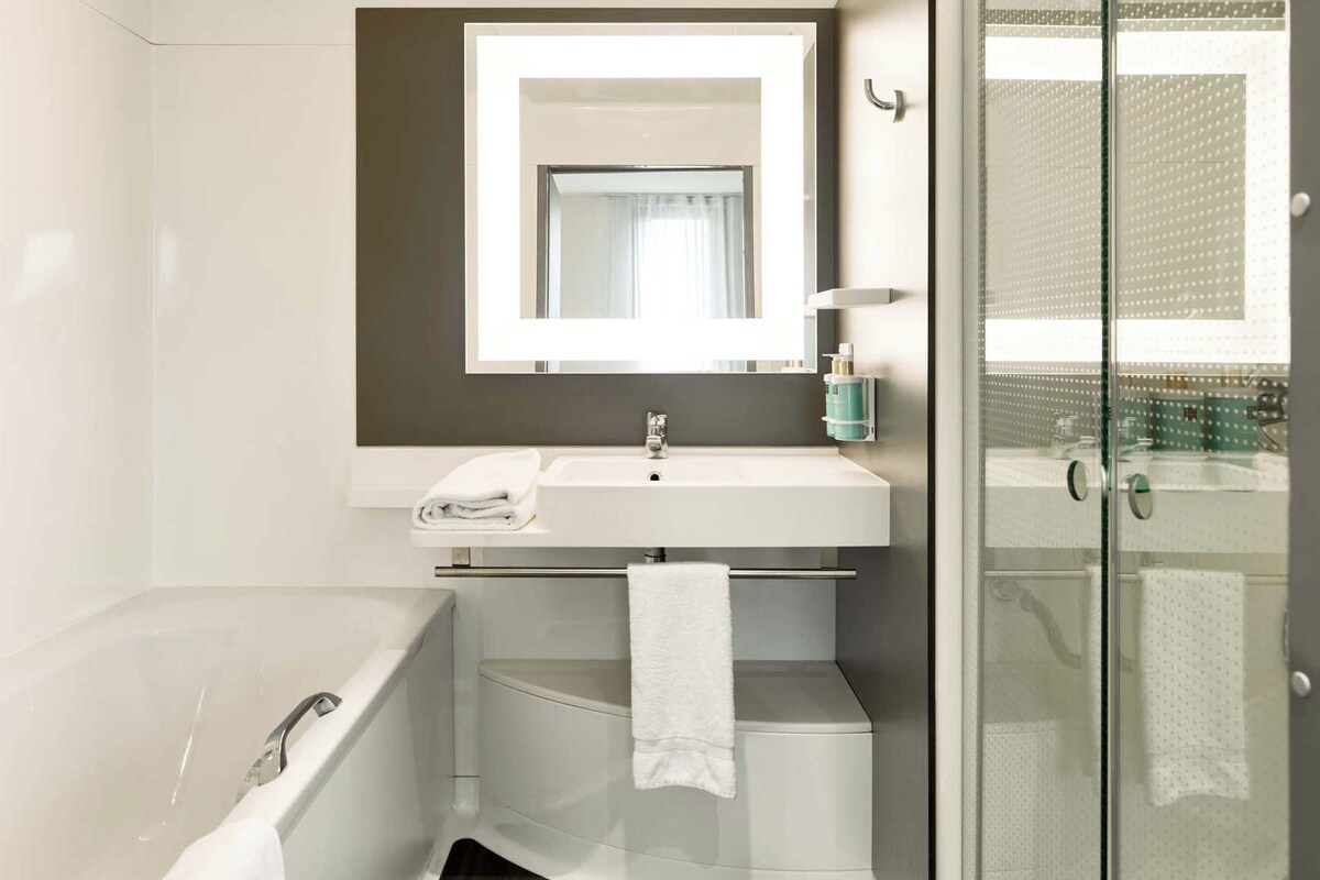 Bathroom | Separate bathtub and shower, free toiletries, hair dryer, towels