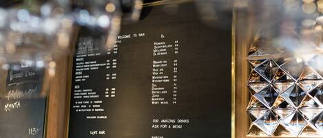 A bar menu with various drink options and prices.