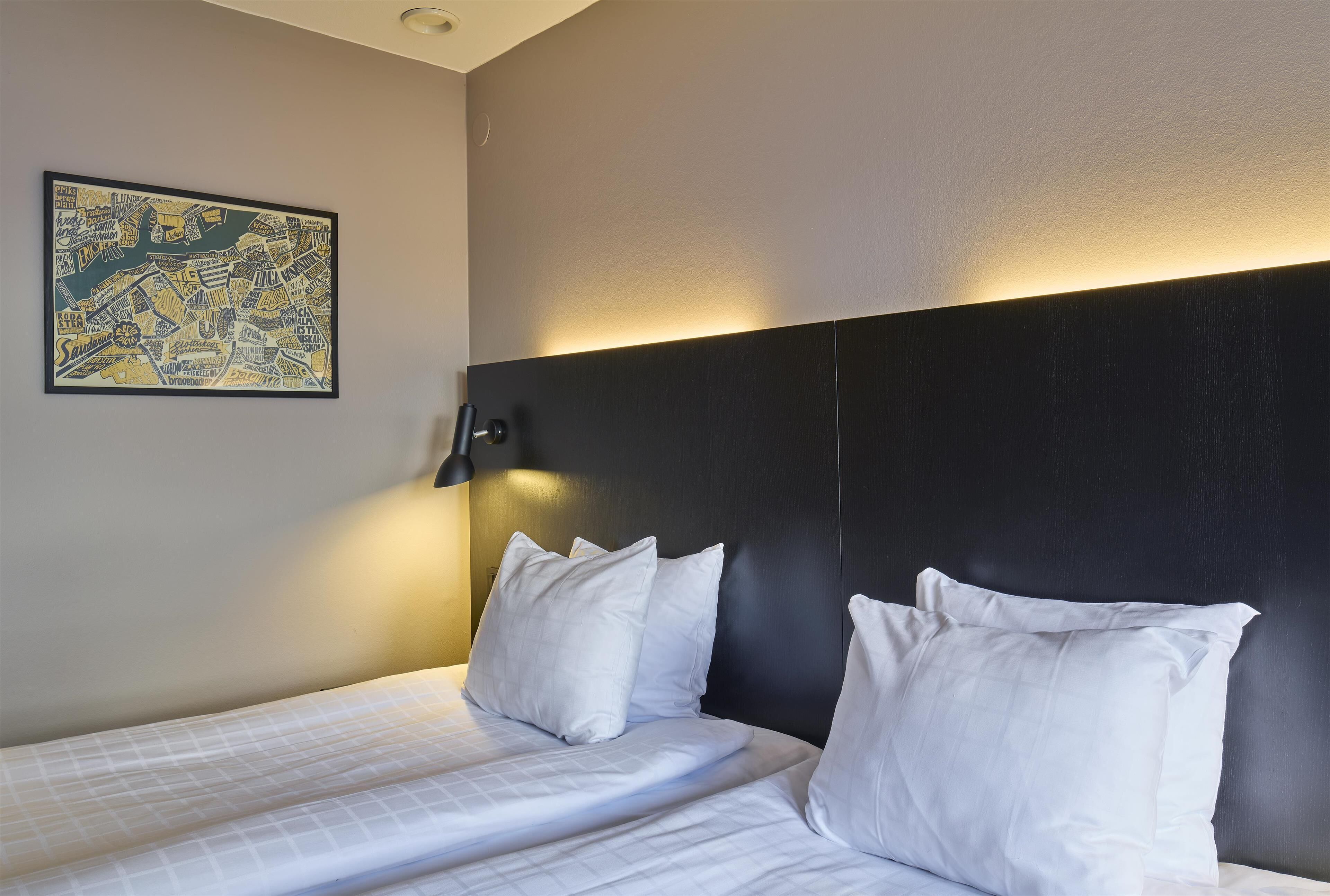 standard twin room | in-room safe, desk, blackout curtains, iron/ironing board