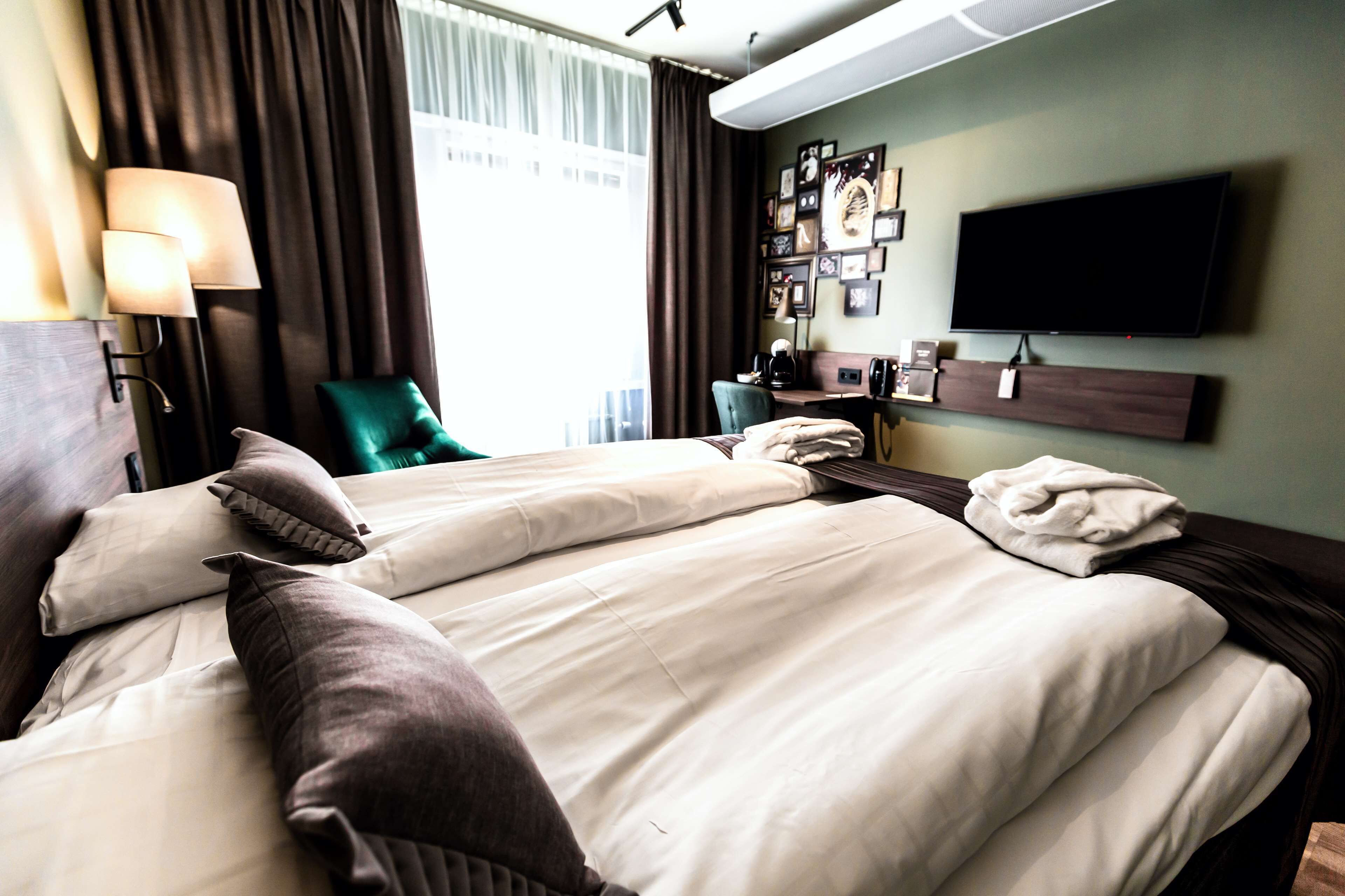 Twin Room | Desk, blackout curtains, iron/ironing board, free cots/infant beds