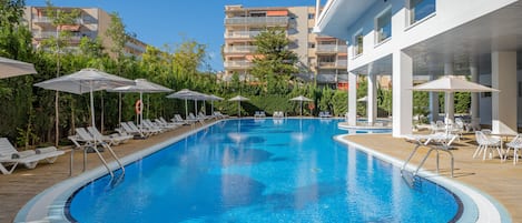 Seasonal outdoor pool, pool umbrellas, pool loungers