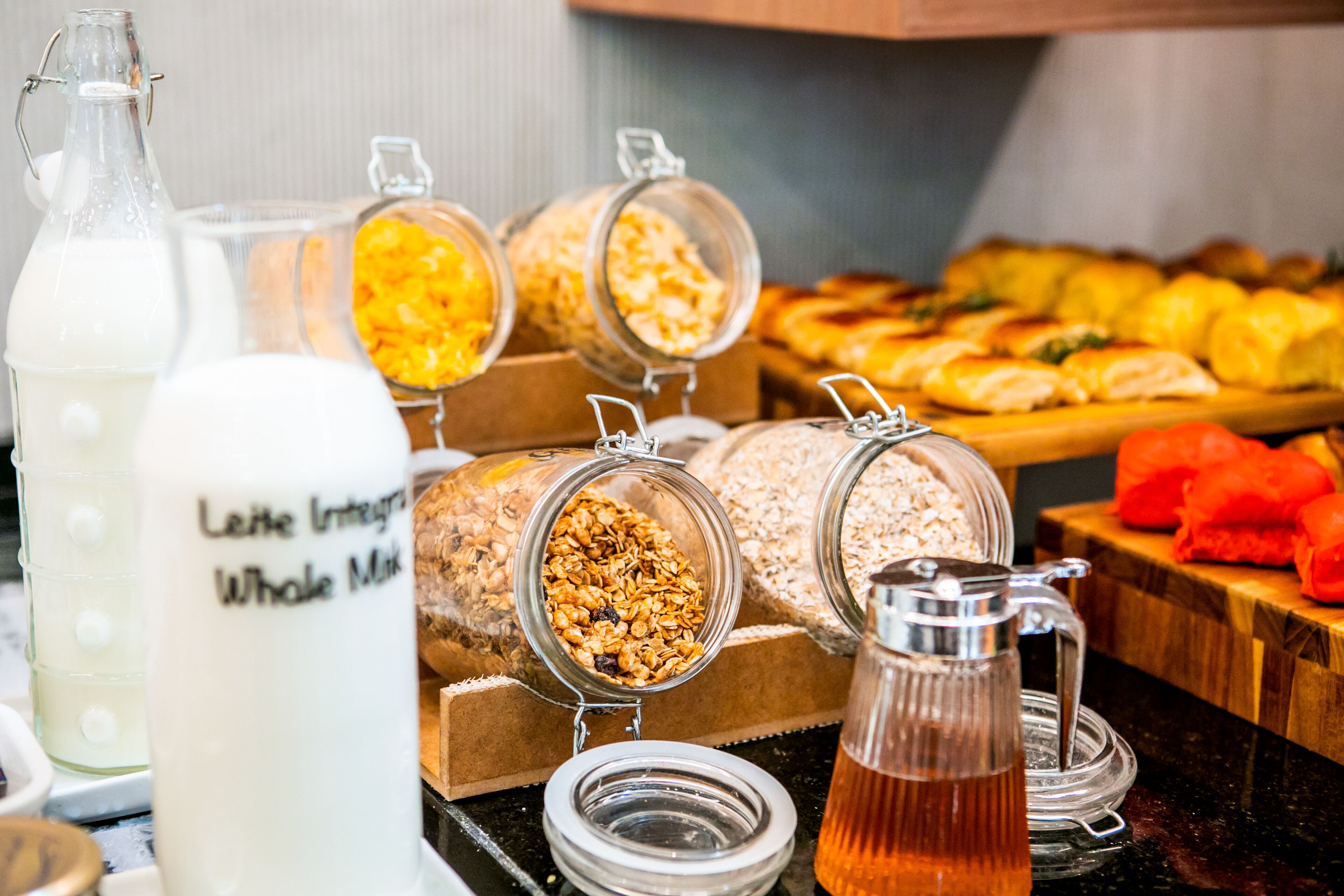 A breakfast buffet with various food items and beverages.