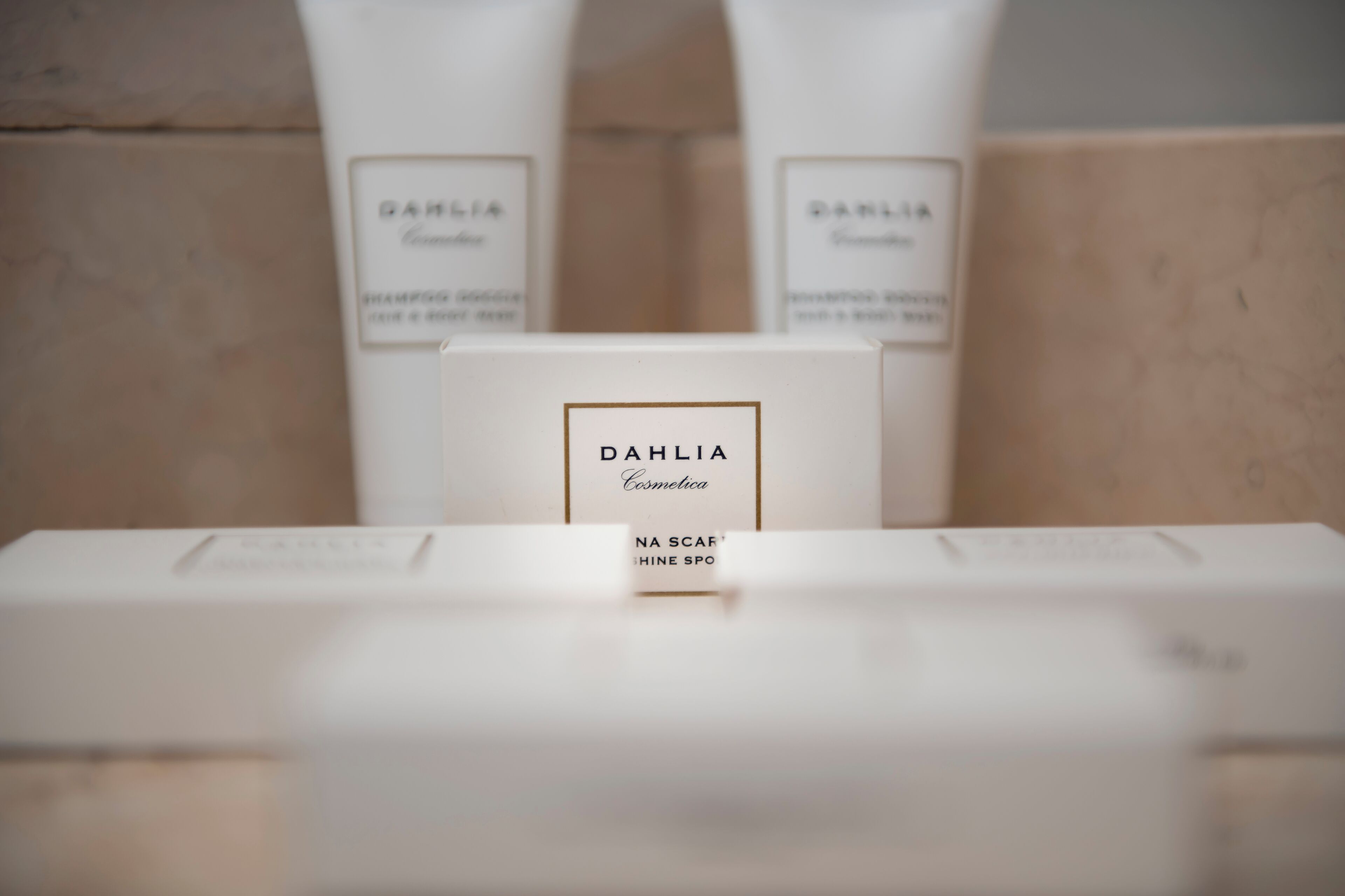 A display of Dalia hair care products in a bathroom setting.