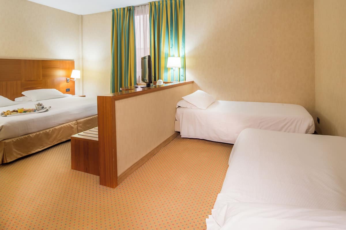 Standard Room, Multiple Beds, Non Smoking | Down comforters, minibar, in-room safe, desk