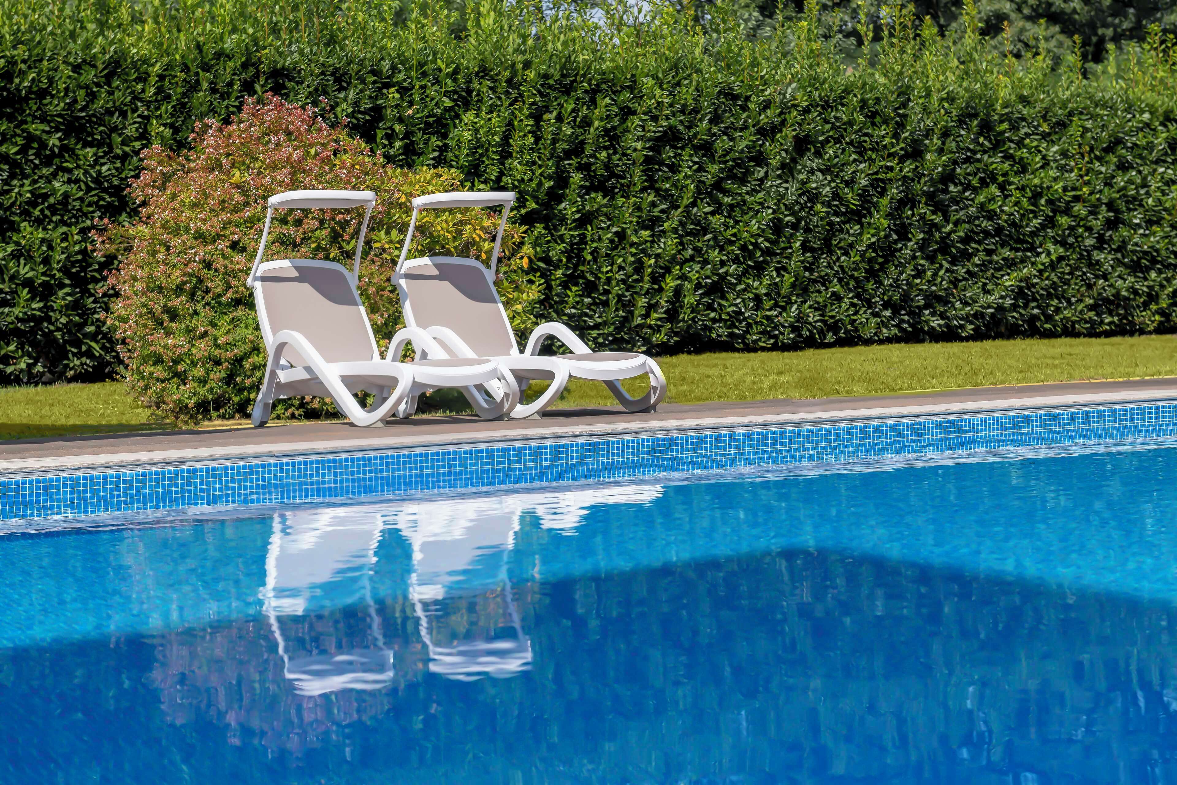 seasonal outdoor pool, pool umbrellas, pool loungers