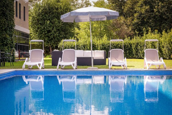 Seasonal outdoor pool, pool umbrellas, pool loungers