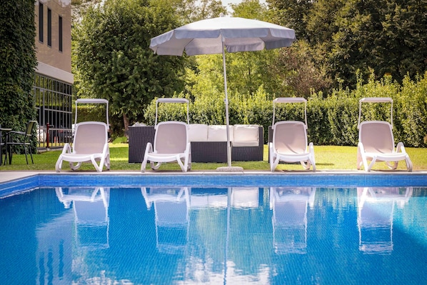 Seasonal outdoor pool, pool umbrellas, pool loungers