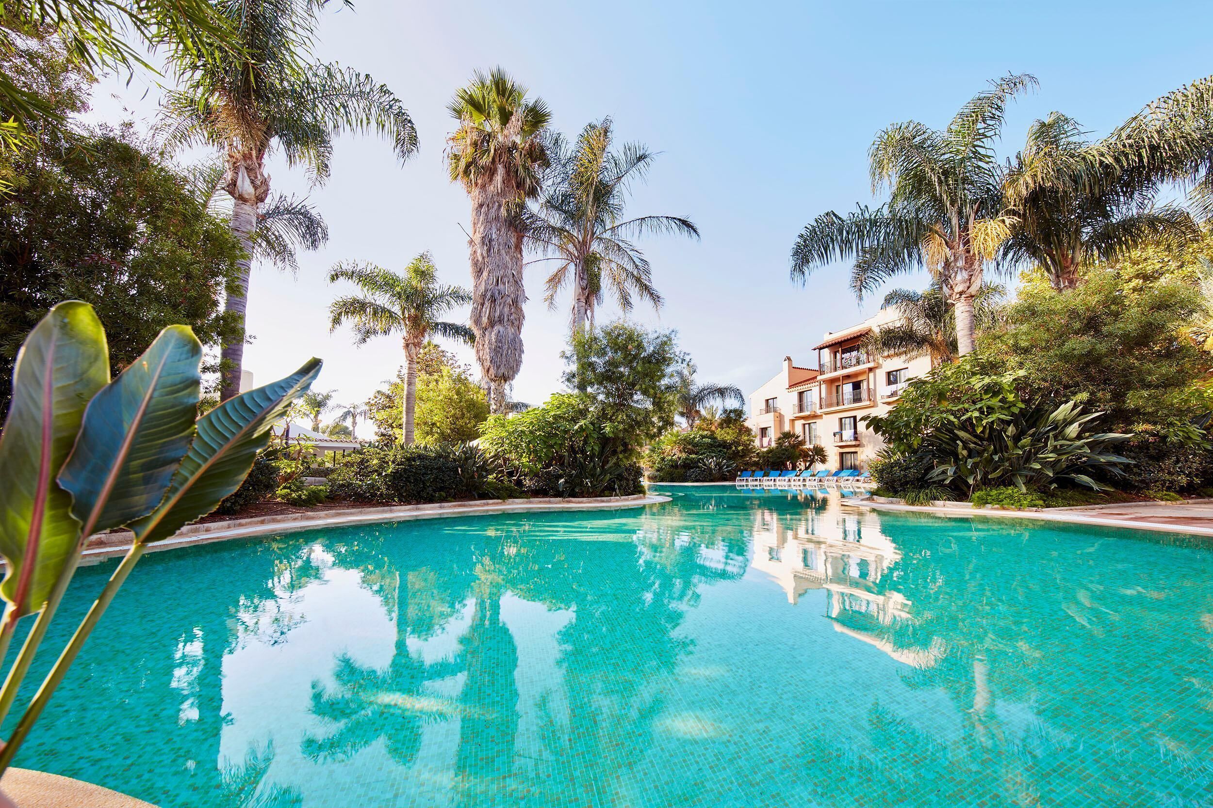 seasonal outdoor pool, pool umbrellas, pool loungers