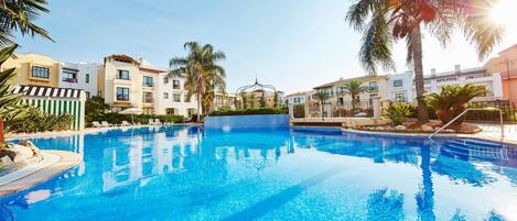 Seasonal outdoor pool, pool umbrellas, pool loungers