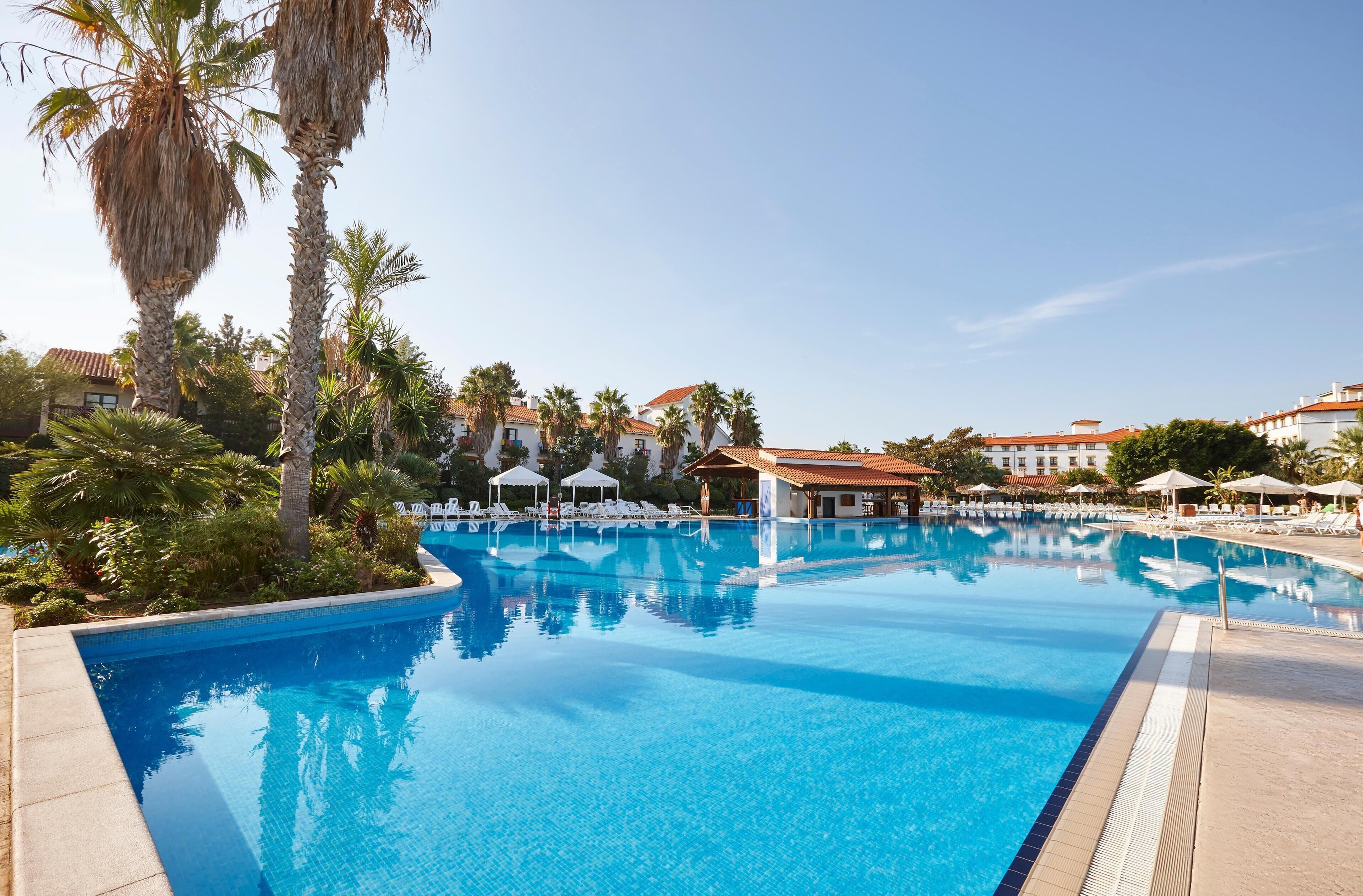 Seasonal outdoor pool, pool umbrellas, sun loungers