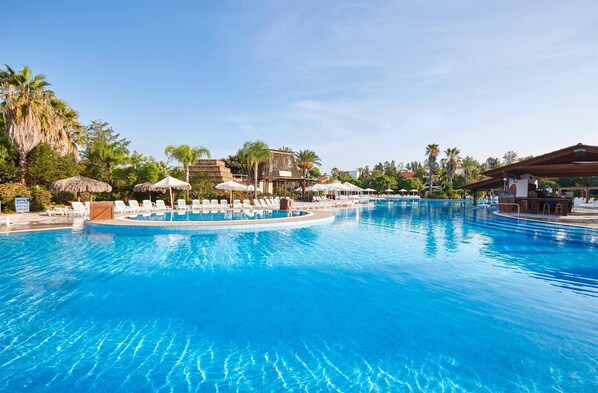 Seasonal outdoor pool, pool umbrellas, pool loungers