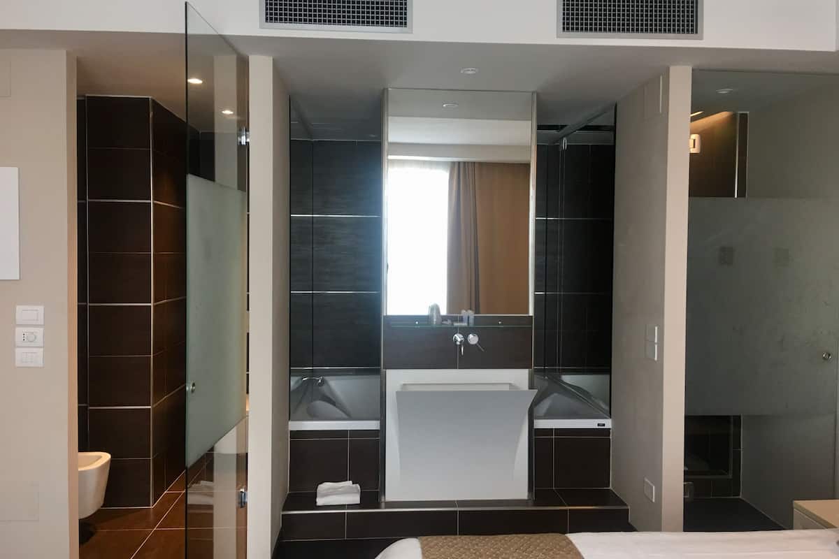 junior suite | bathroom | rainfall showerhead, free toiletries, hair dryer, bidet