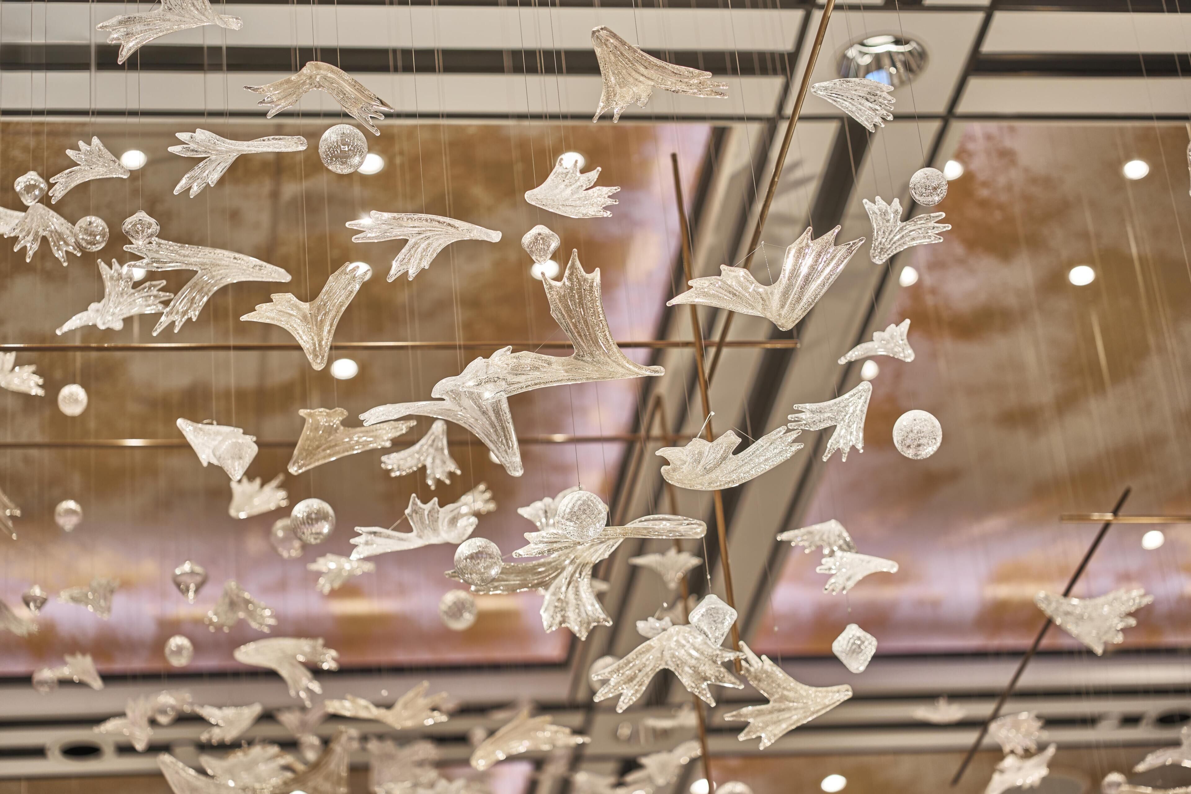 A ceiling with hanging decorative elements.