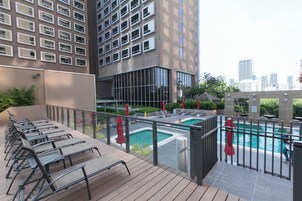 Outdoor pool, open 7 AM to 8:00 PM, pool umbrellas, pool loungers